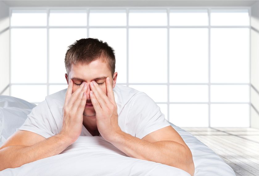 sleep apnea Tired man wiping face