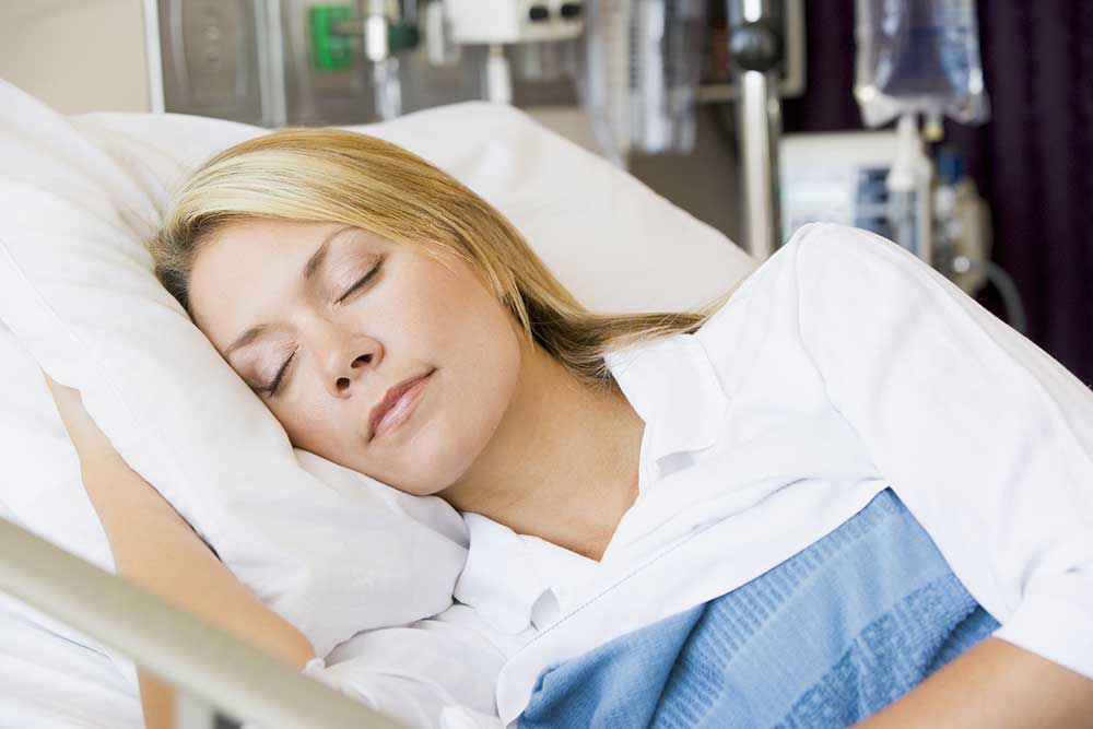 Woman sleeping peacefully in bed