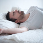 Man,Sleeping,In,His,Bed,And,Snoring,Loudly
